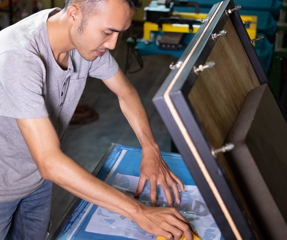 A guy using transfer paper 